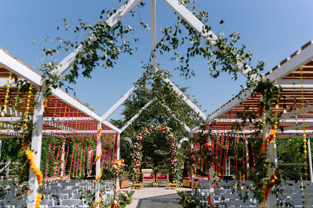 Beautiful Outdoor Archers frame your big moment in romance, elegance and the showcases the vibrancy of a texas wedding in Italy, Texas.  Make this space into your dream venue with drappery, flowers, greenery or lighting.